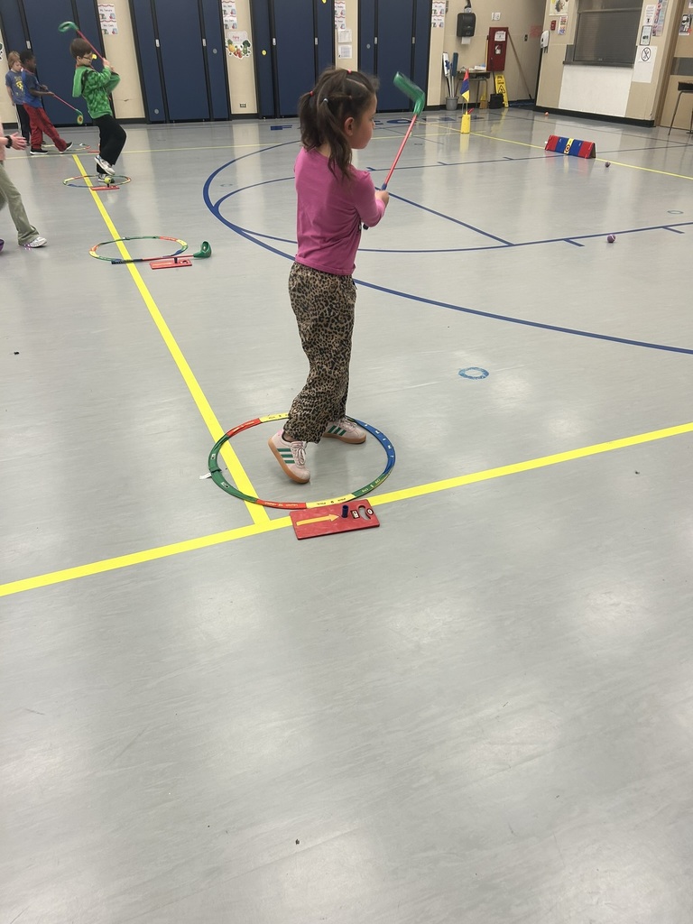 Students working on golf fundamentals