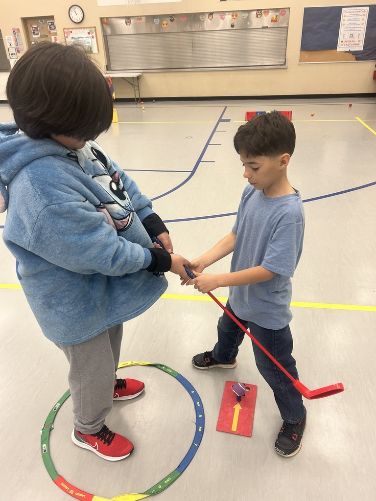 Students working on golf fundamentals