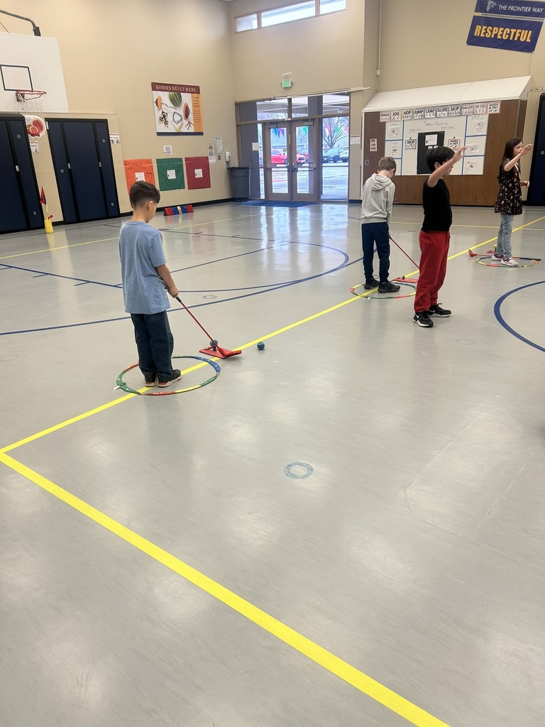 Students working on golf fundamentals