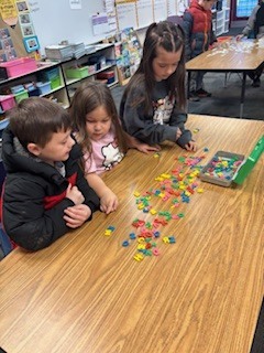 students working on desktops.