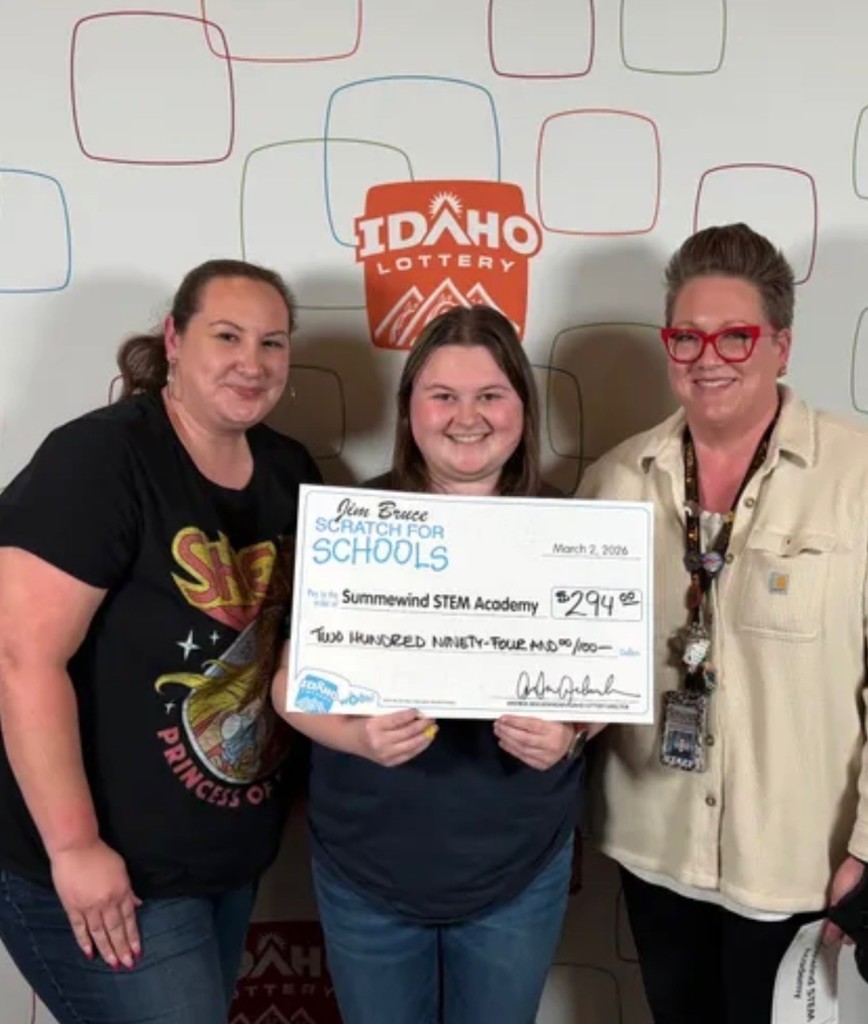 Bobbi Jo, Breanna, and Aimee holding Scratch for schools check