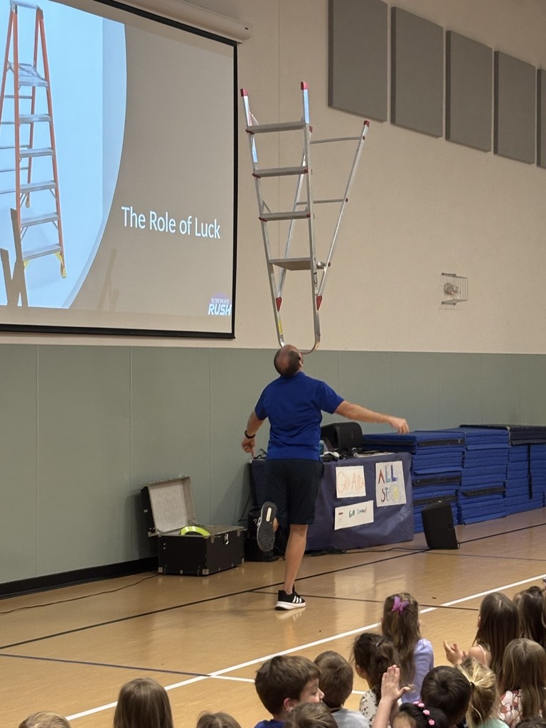 Balancing a ladder on his chin