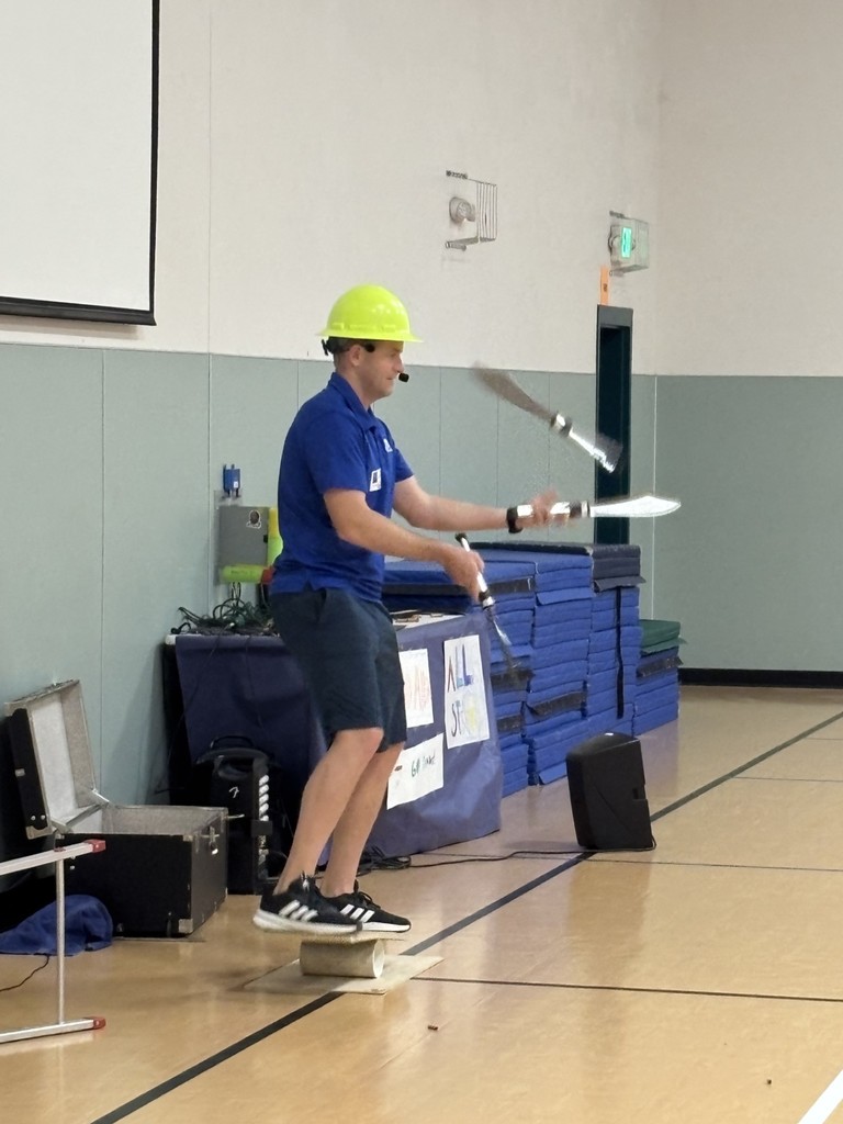 balancing on a board while juggling knives