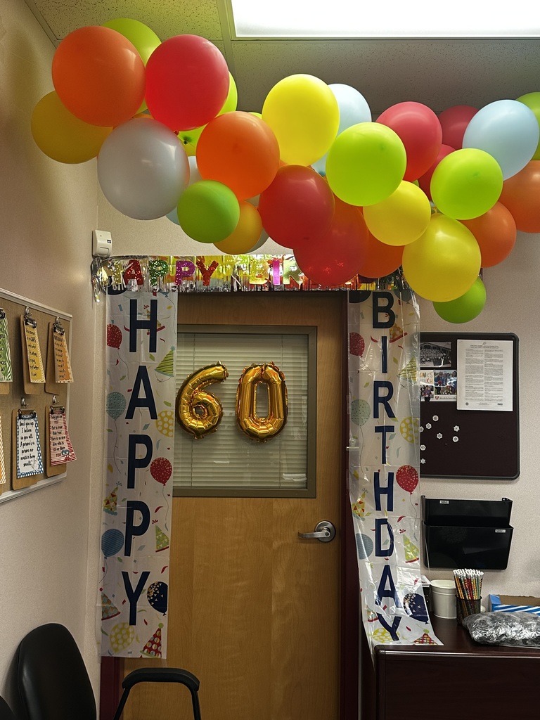 door with balloons and happy birhtday sign