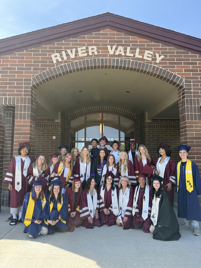 Students in caps and gowns outside of River Valley