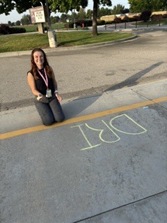 woman drawing with chalk