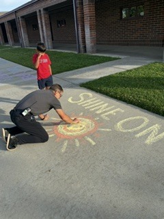 man drawing with chalk
