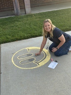 woman drawing with chalk