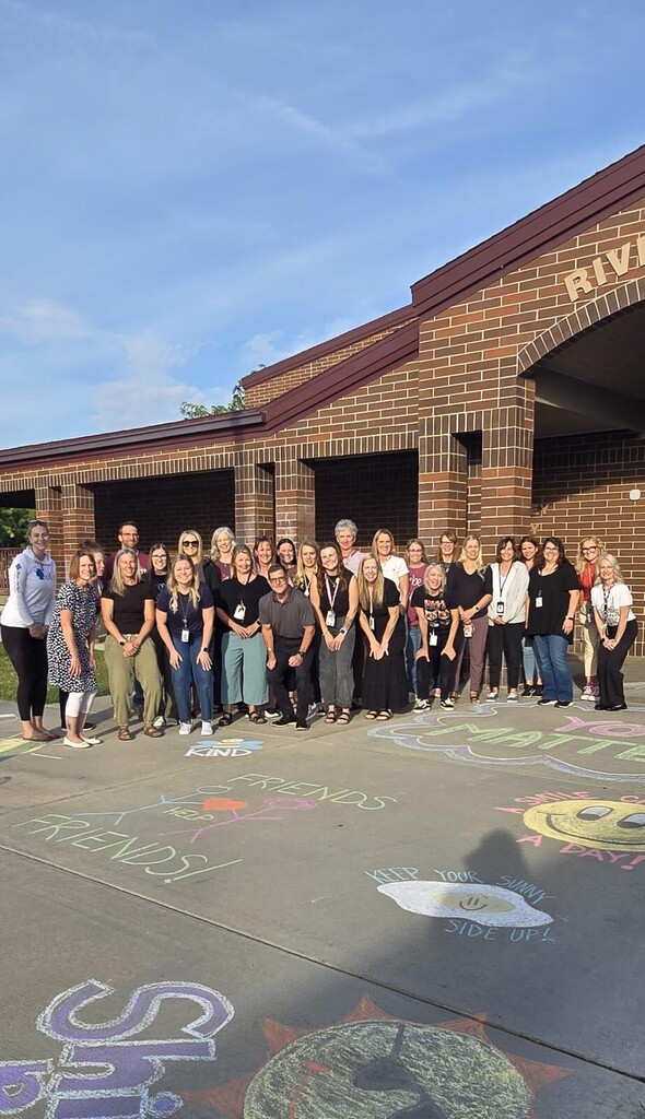 people in front of a school