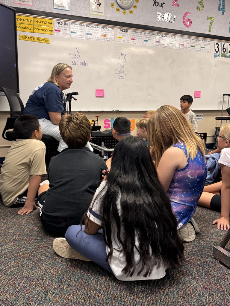 Mrs. Dunlop visiting with 4th grade students about "Be the Ripple, Create the Wave"