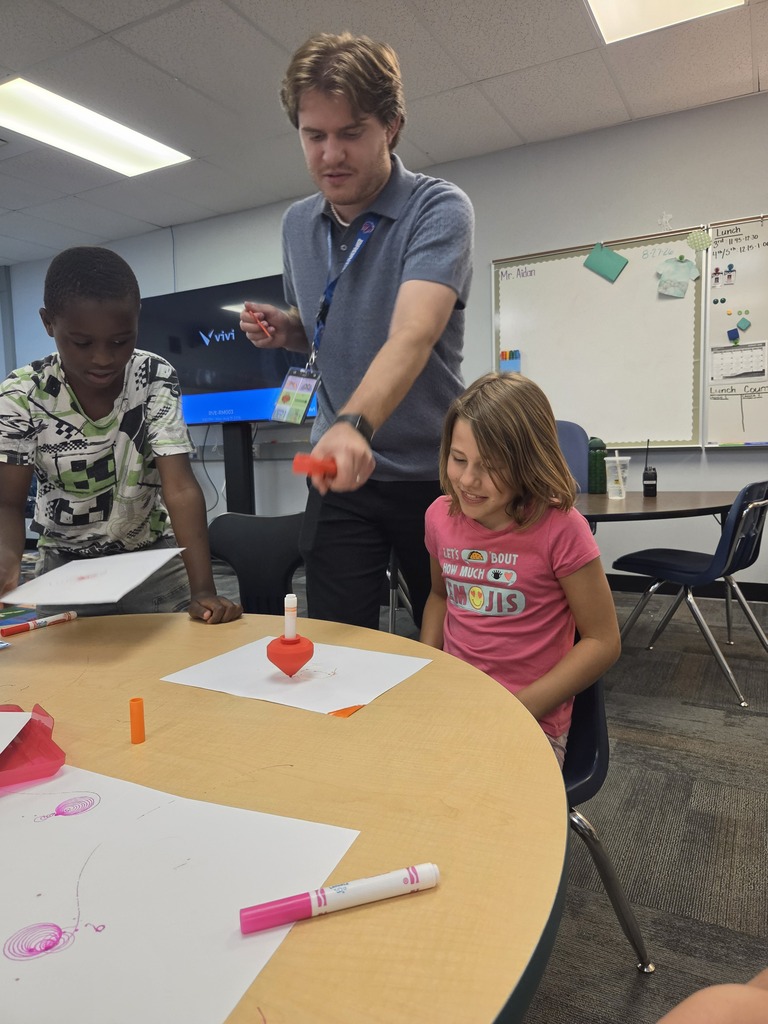 man demonstrating marker art with kids