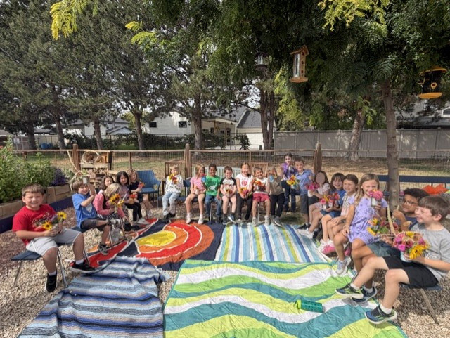 first graders in garden
