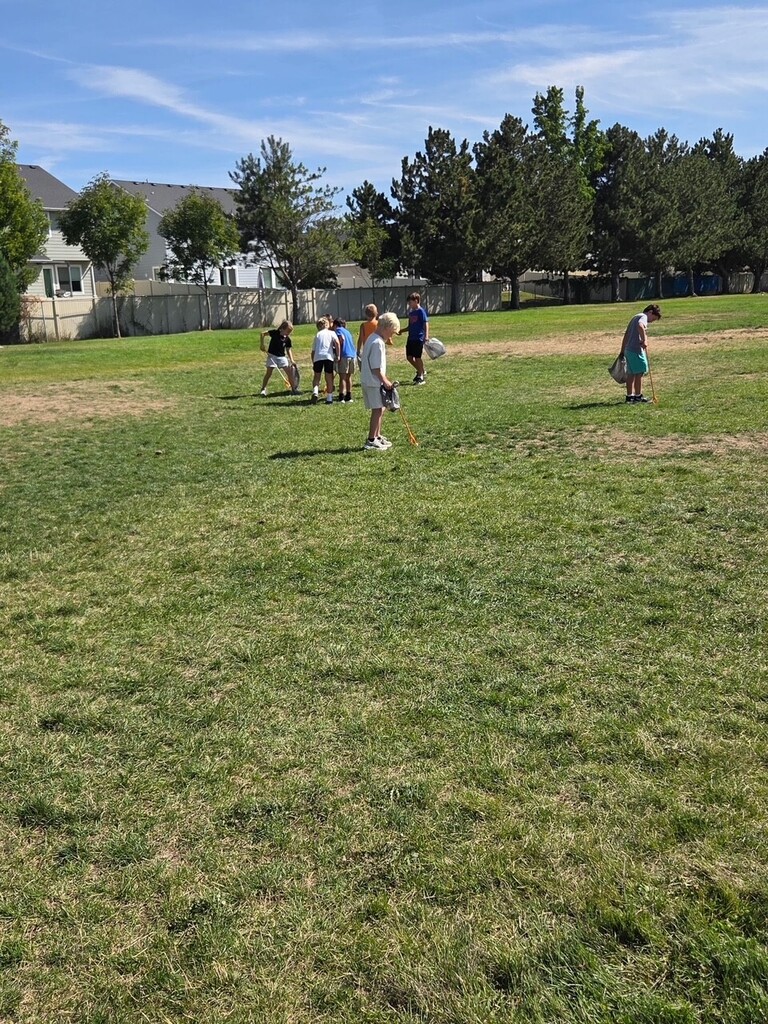 student picking up trash