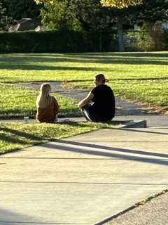 a teacher and student talking after school