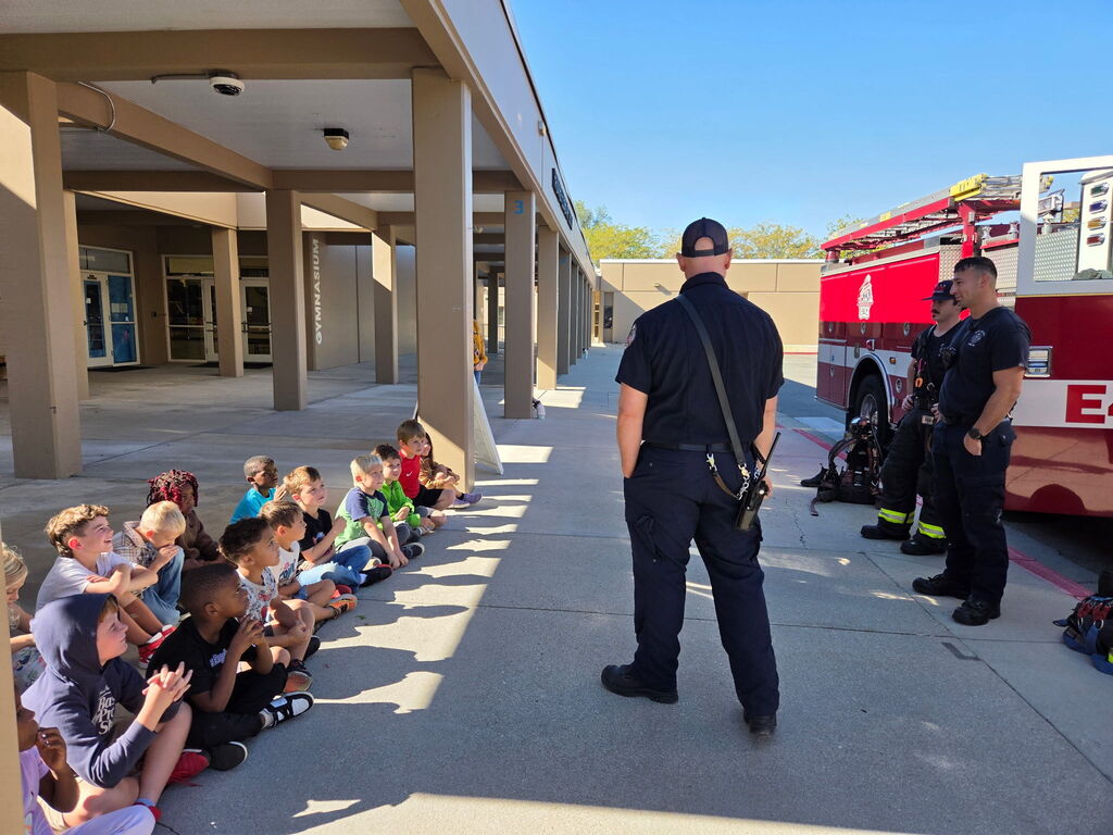 Boise Firemen talking to first graders about fire safety. 