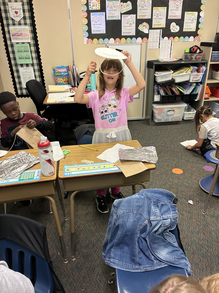 2nd grader building her hat