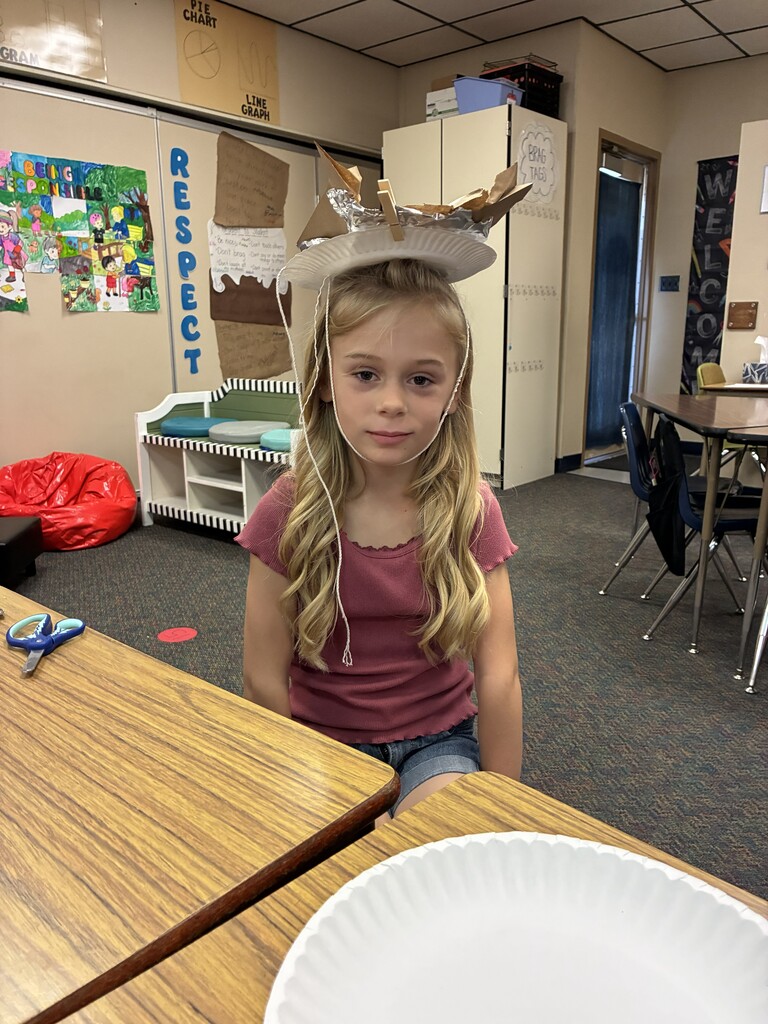 2nd grader wearing her hat