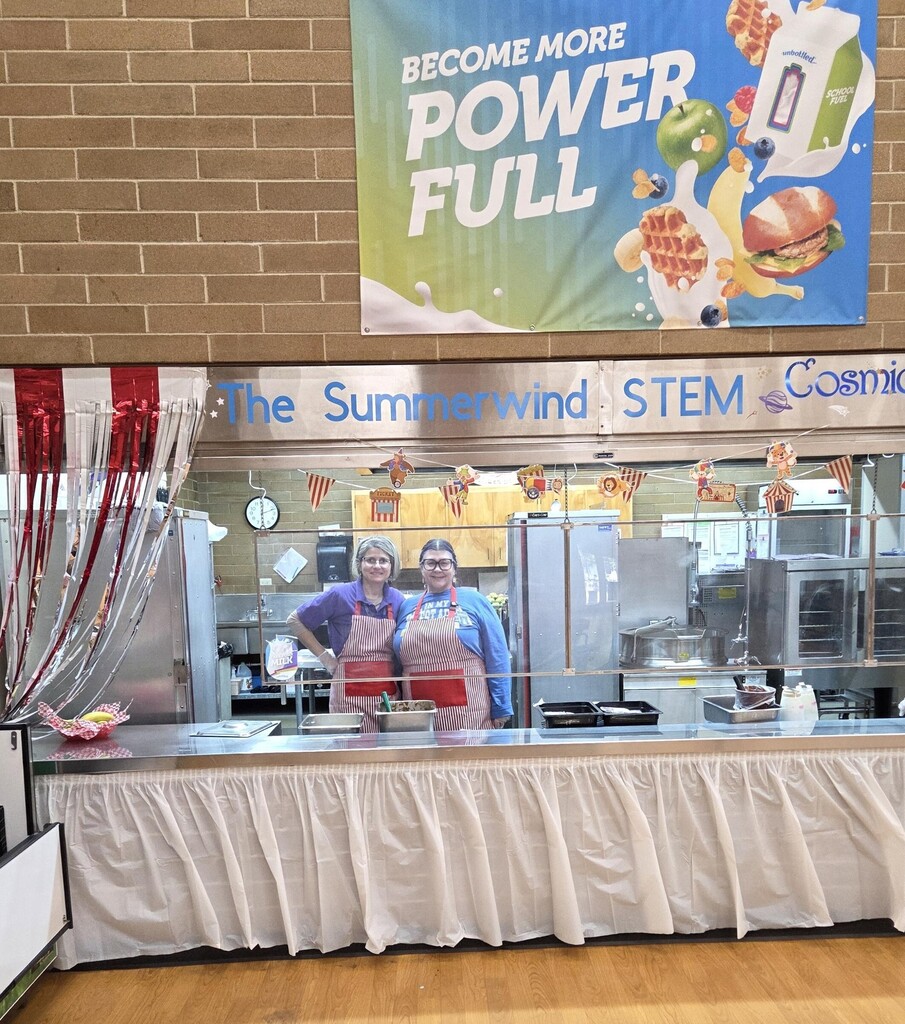 Kitchen Staff standing at serving counter
