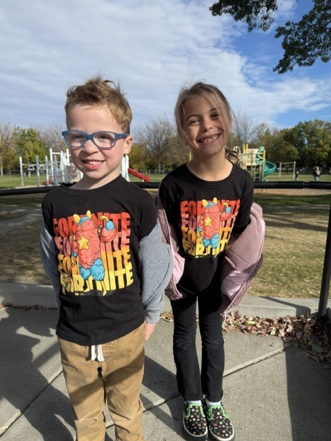 two students wearing matching Fortnite shirts