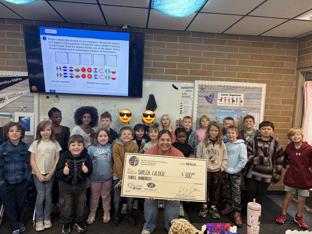  Teacher with students and Grant check