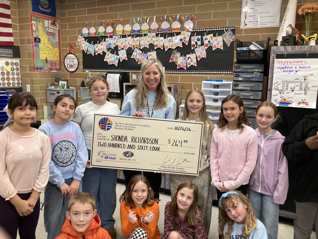  Teacher with students and Grant check