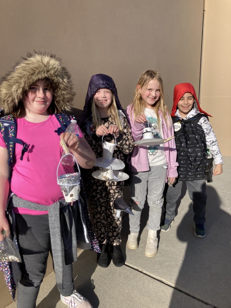 2nd grade students with their bird feeders