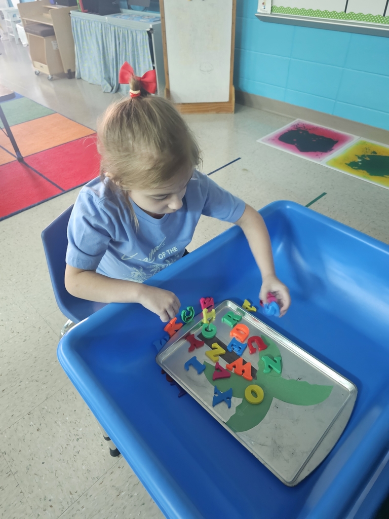 Mrs. Leigh's class getting in the swing of the new school year in circle time, story time, and learning labs.