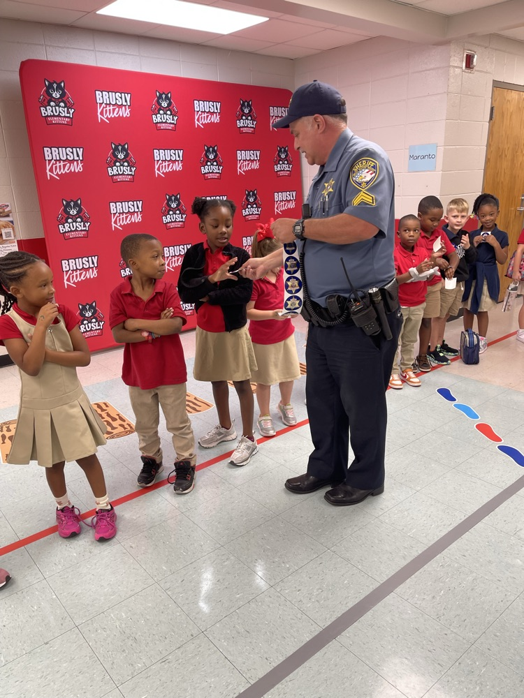 SRO giving students stickers for good behavior 