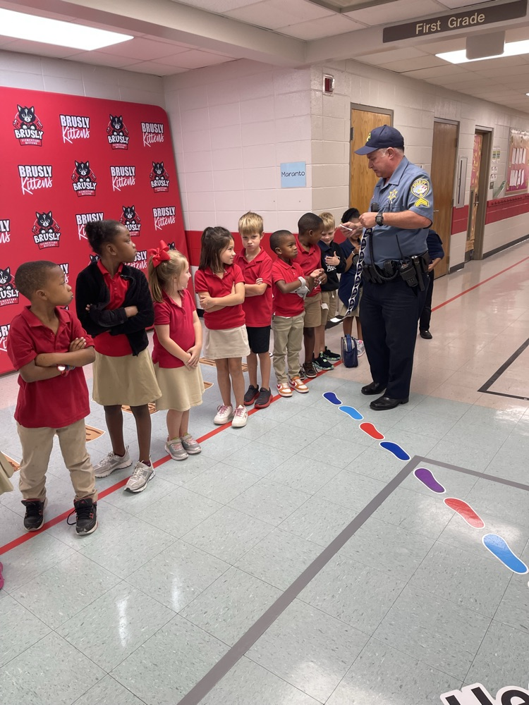 SRO giving students stickers for good behavior 