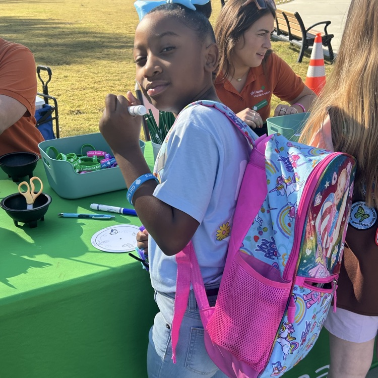  Port Allen Elementary Girl Scouts enjoying an event at BR Zoo. They learned about animals and how to take care of our planet. 