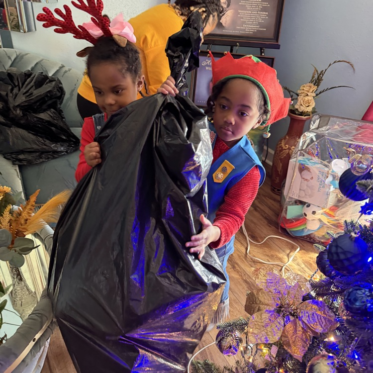 PAES Girl Scouts helping today with The Anderson's Toy Give Away! 🧸 