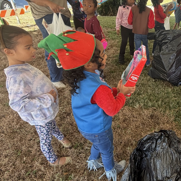 PAES Girl Scouts helping today with The Anderson's Toy Give Away! 🧸 