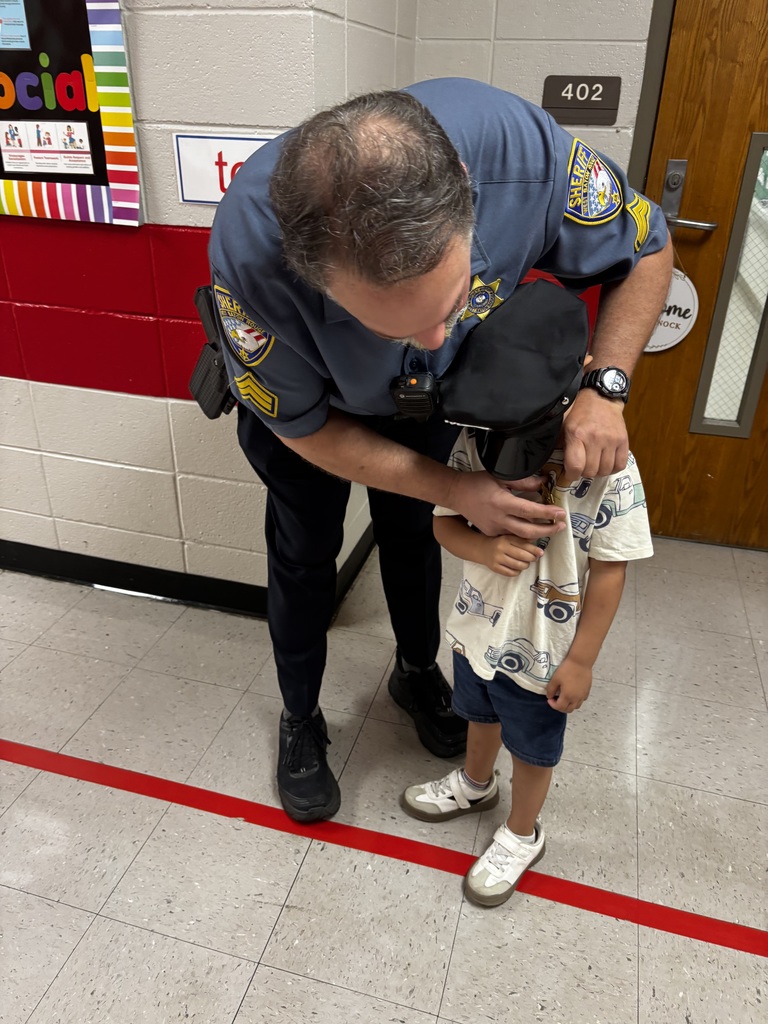 Liam getting ready for his day as an officer.