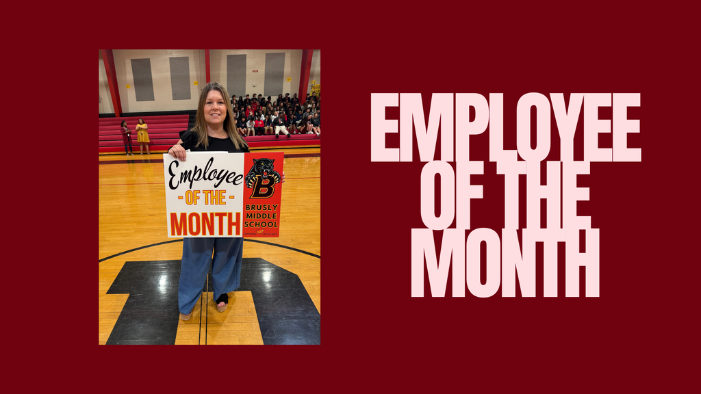 Person holding sign in gymnasium. Text reads "Employee of the Month." Background shows a gym with a crowd.