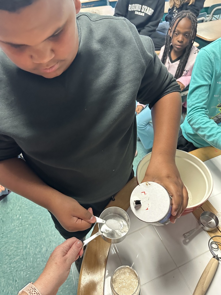 student measuring salt