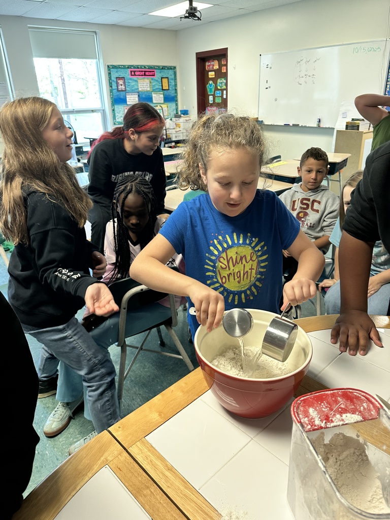student adding water