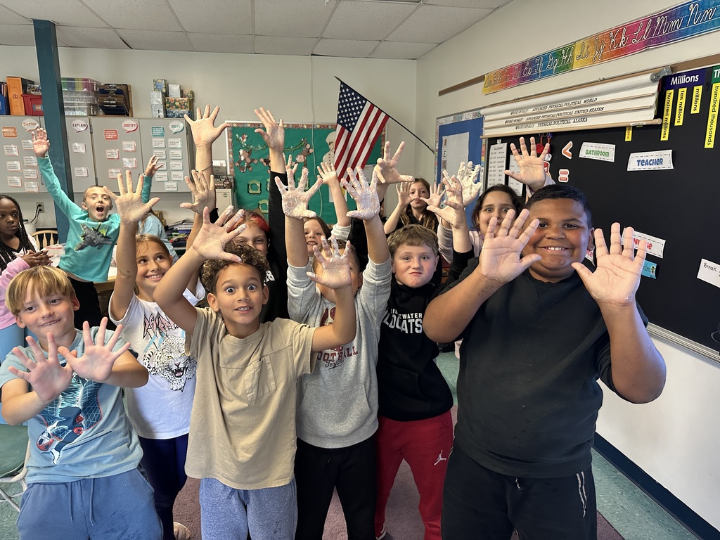 students showing off hands sticky from the starter