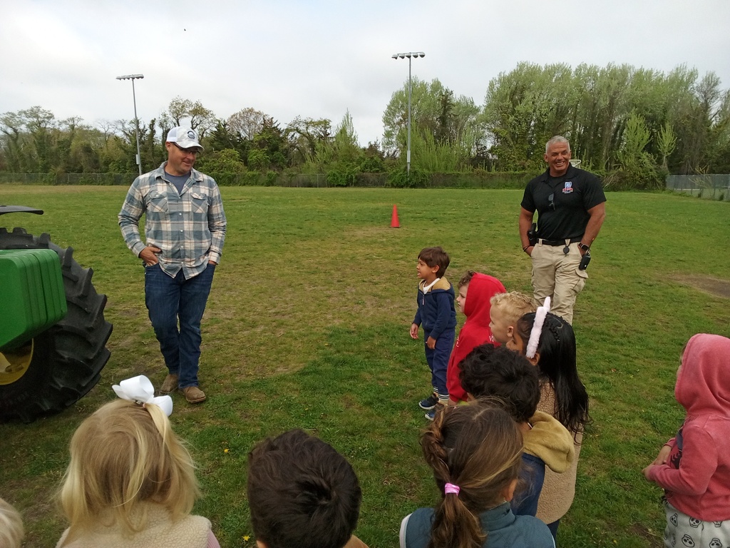 Mr. Reeves shows students farming equipment