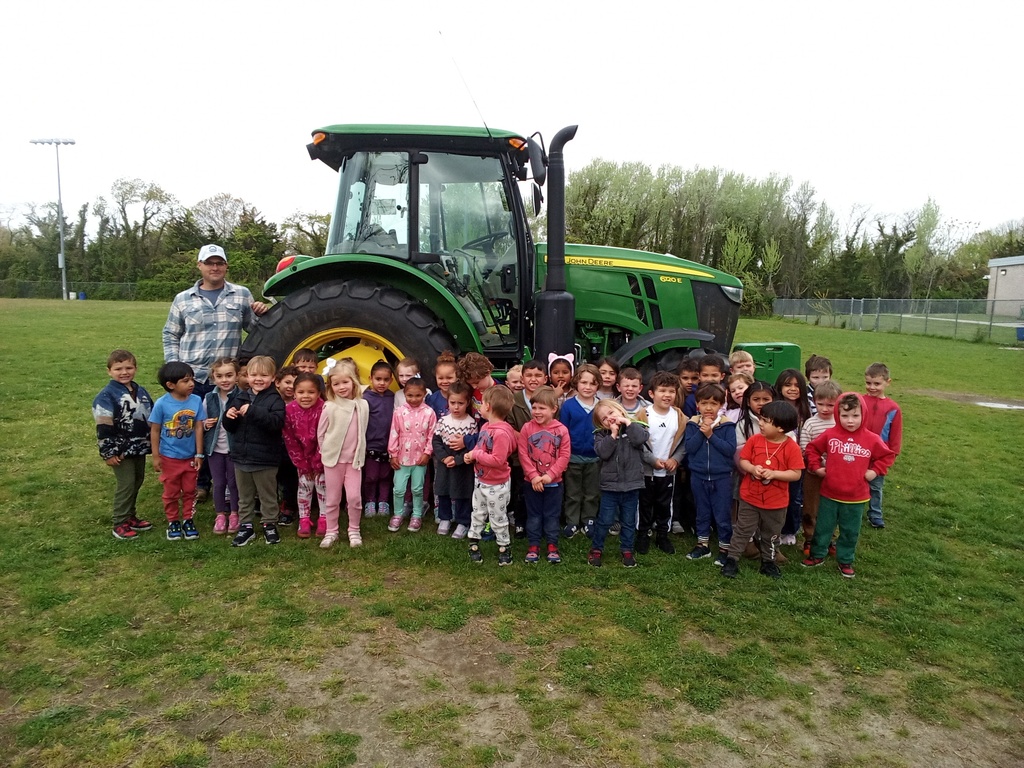 Mr. Reeves shows students farming equipment