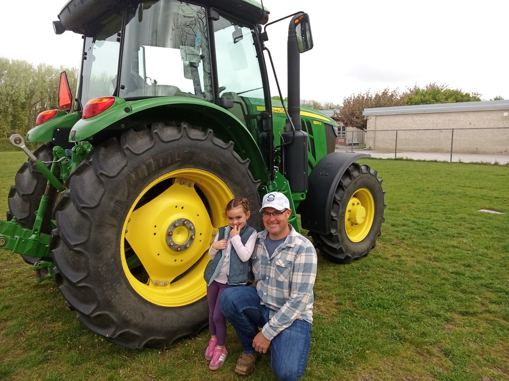 Mr. Reeves shows students farming equipment