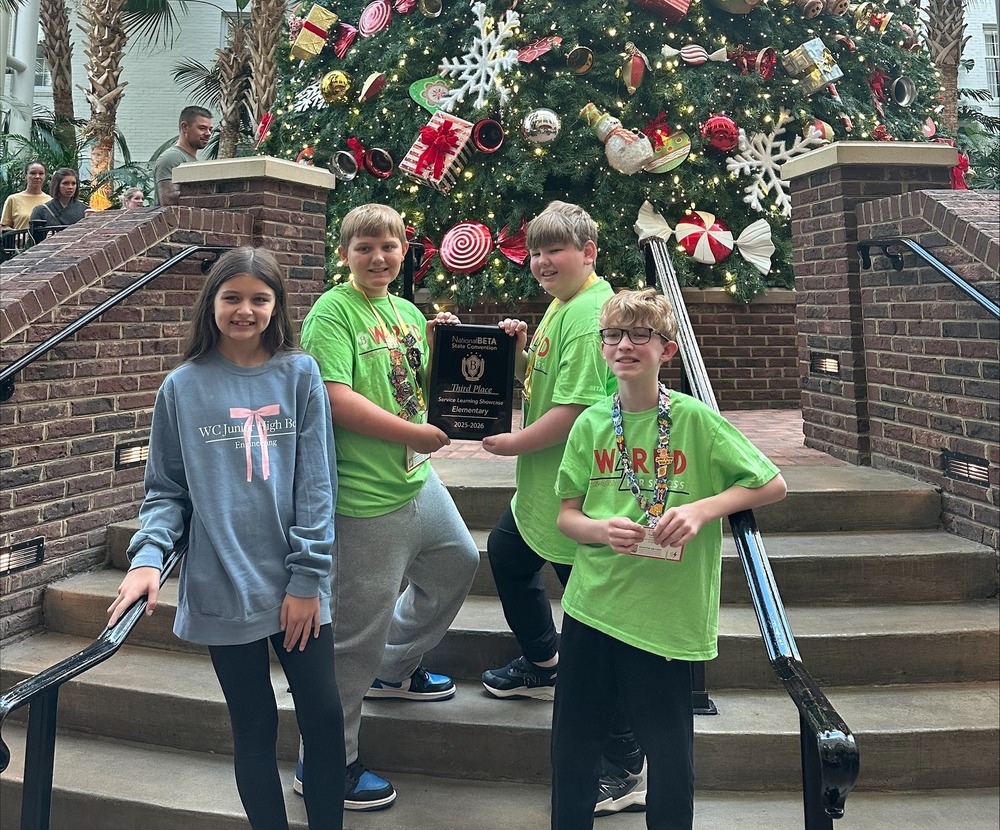 wces beta students in front of tree