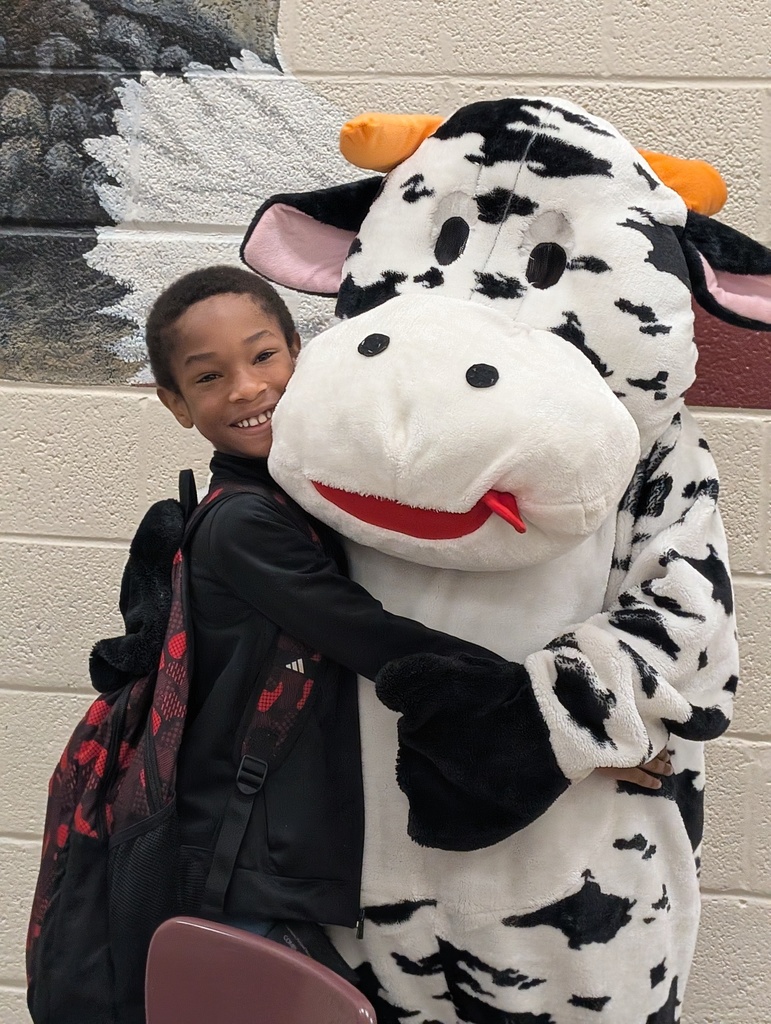 students and staff celebrated school milk day with cow mascot and lunch ladies