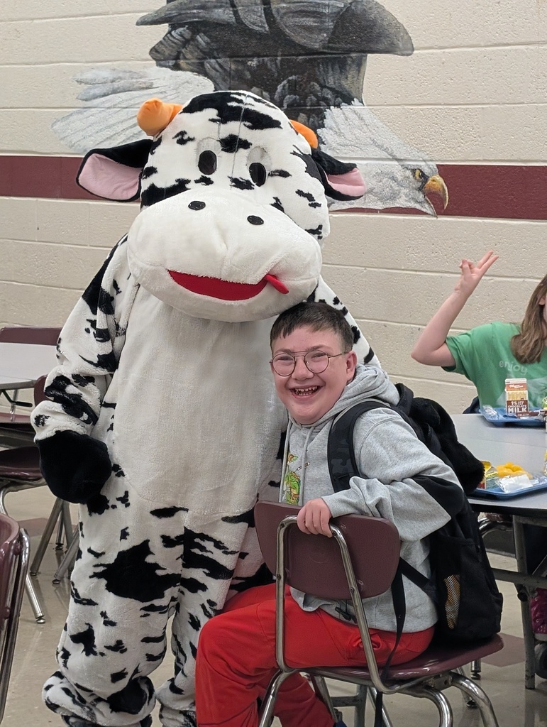 students and staff celebrated school milk day with cow mascot and lunch ladies