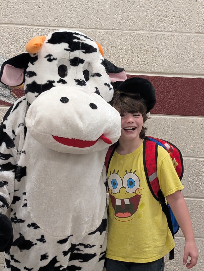 students and staff celebrated school milk day with cow mascot and lunch ladies
