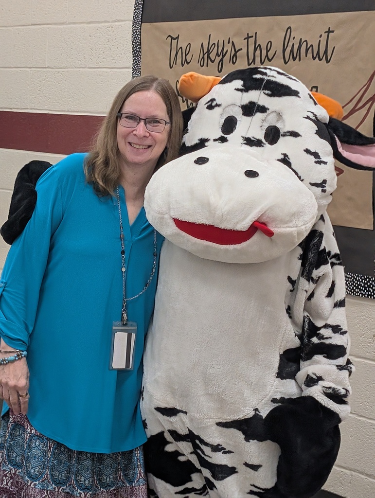 students and staff celebrated school milk day with cow mascot and lunch ladies