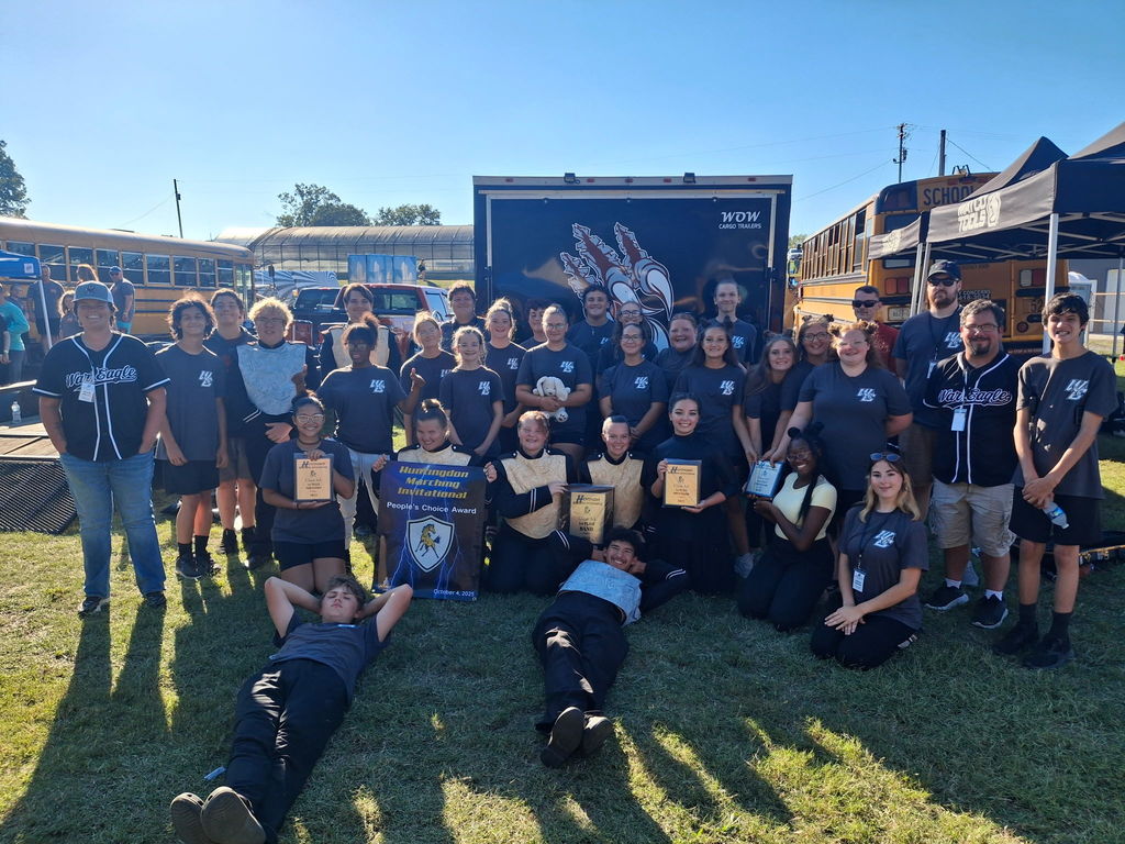 wcssd students in band after competing in band competition, wearing wc school shirts and displaying awareds
