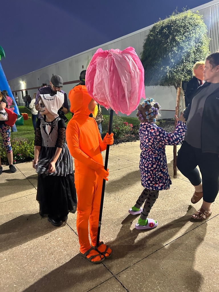 students and families enjoying the boo bash at wchs in costumes and pumpkins from contenst from the evening
