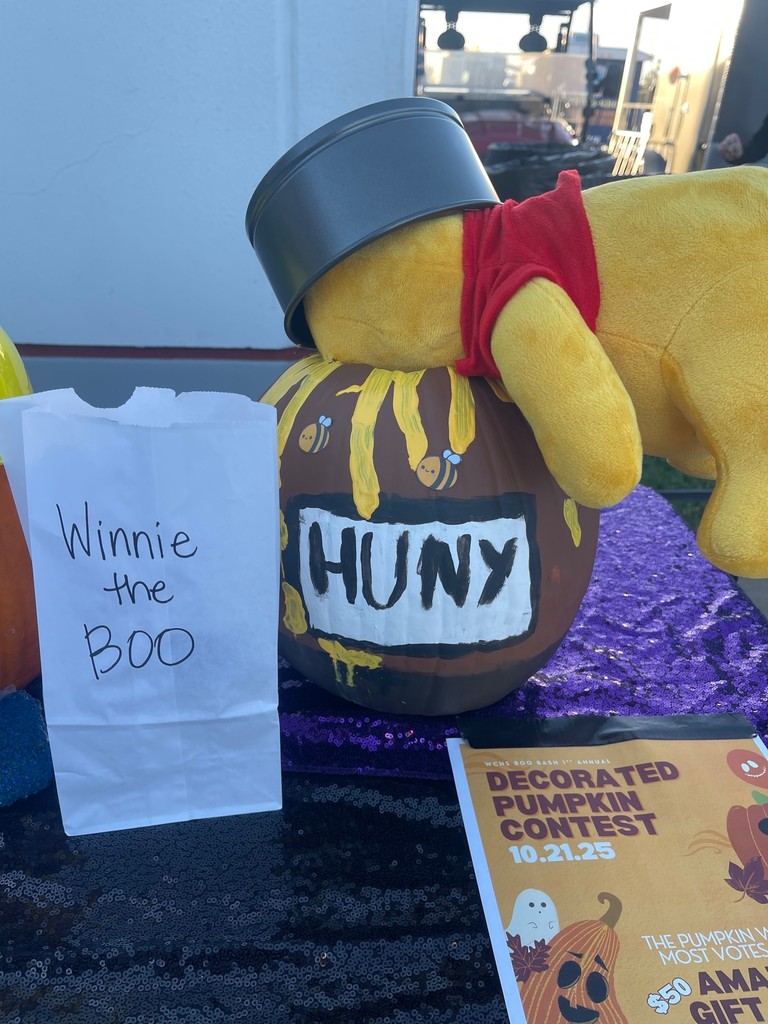 students and families enjoying the boo bash at wchs in costumes and pumpkins from contenst from the evening