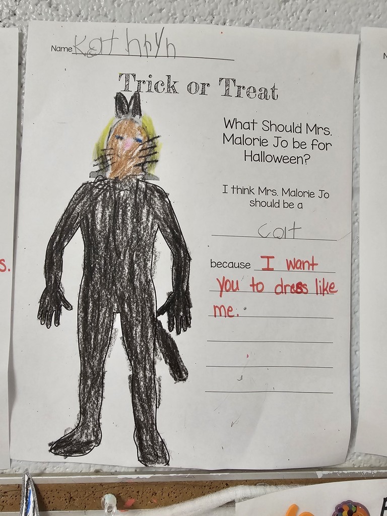 teacher dressed in costume created by kindergarten student