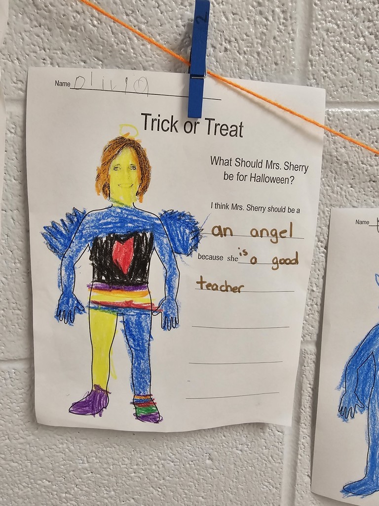 teacher dressed in costume created by kindergarten student